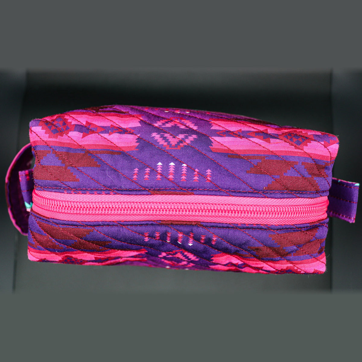 Back of the pink and purple boxy bag
