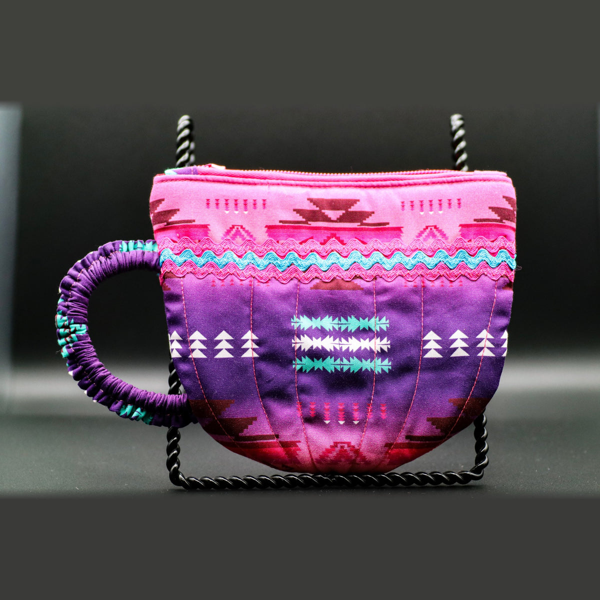 Teacup-shaped quilted bag in pink and purple, front view