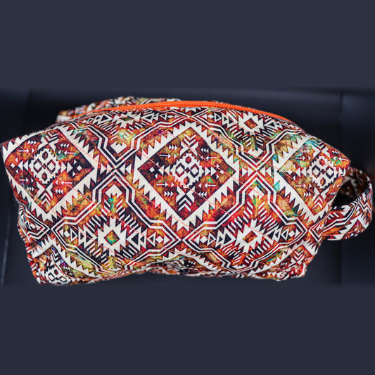 Boxy quilted bag in a rust and cream diamond print, front view