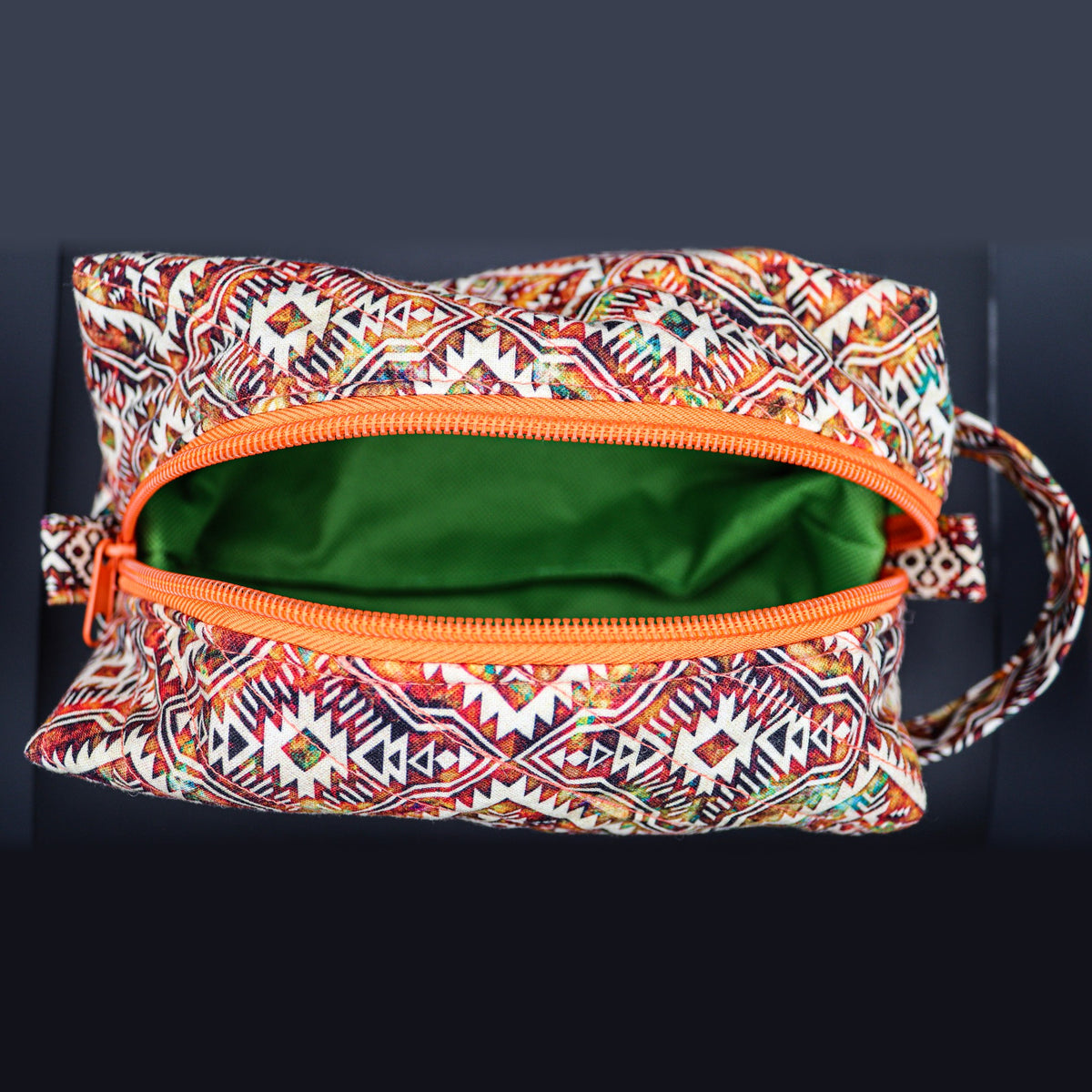 Inside of the diamond print boxy bag: green lining